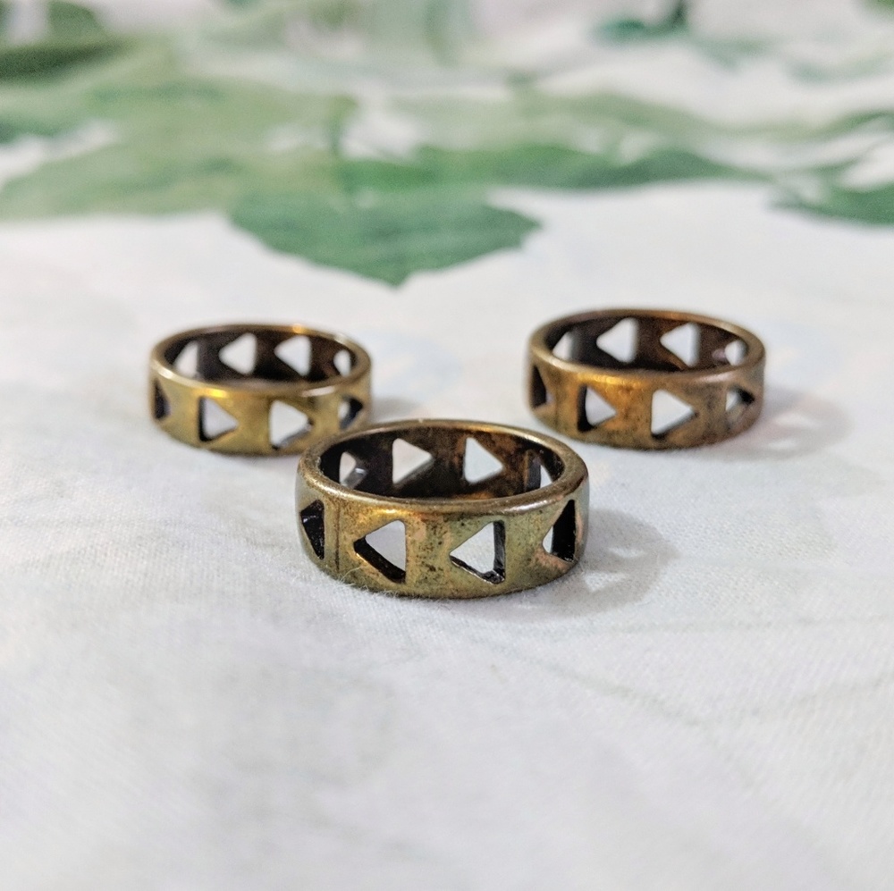 Three Bronze Rings With Triangle Cutouts